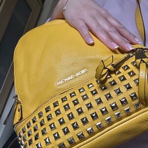 Medium sized Michael Kors studded backpack in dark yellow 💛